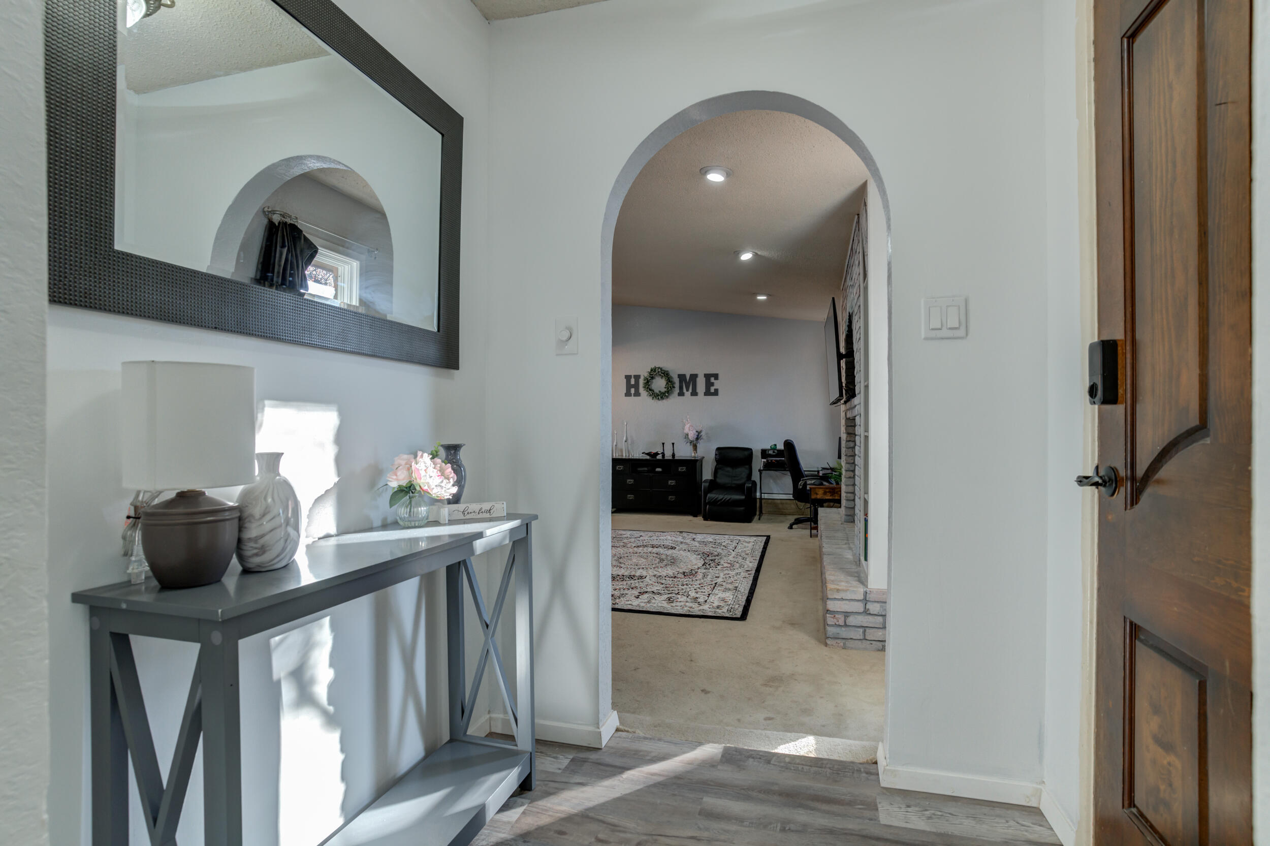 4524 79th Street Lubbock, TX 79424 - Photo 7 of 45 a living room with furniture and a fireplace