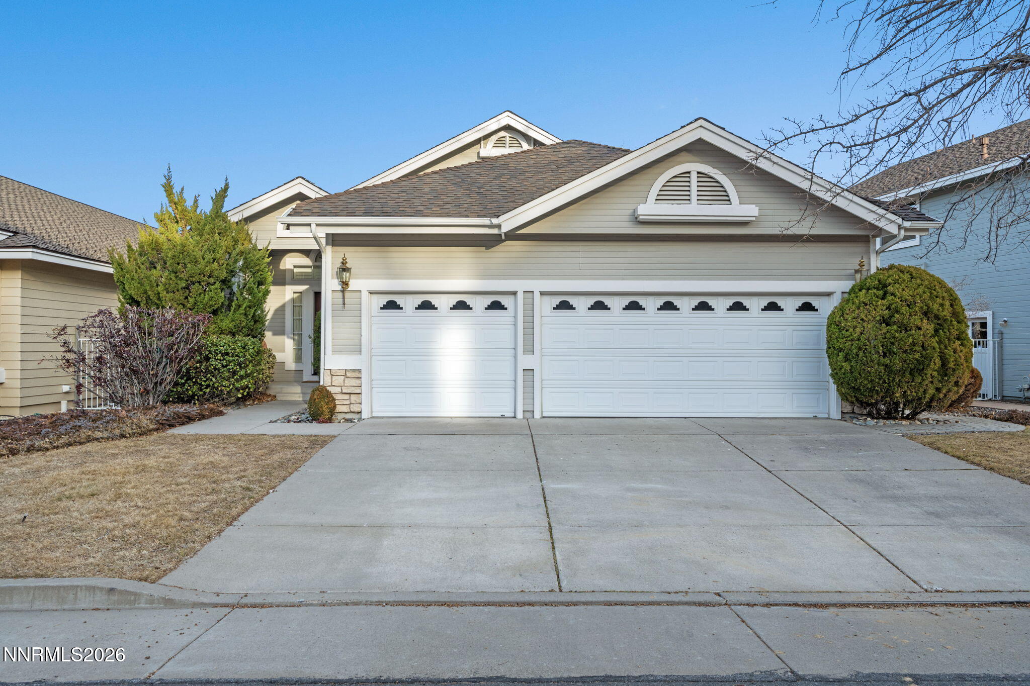6186 Squires Lane Reno, NV 89519 - Photo 56 of 57 a front view of a house with garden