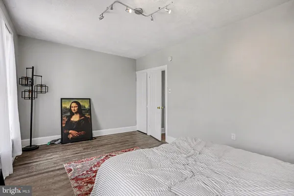 a bedroom with a bed and a couch