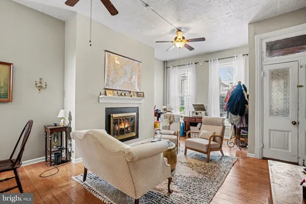 a living room with furniture and a fireplace