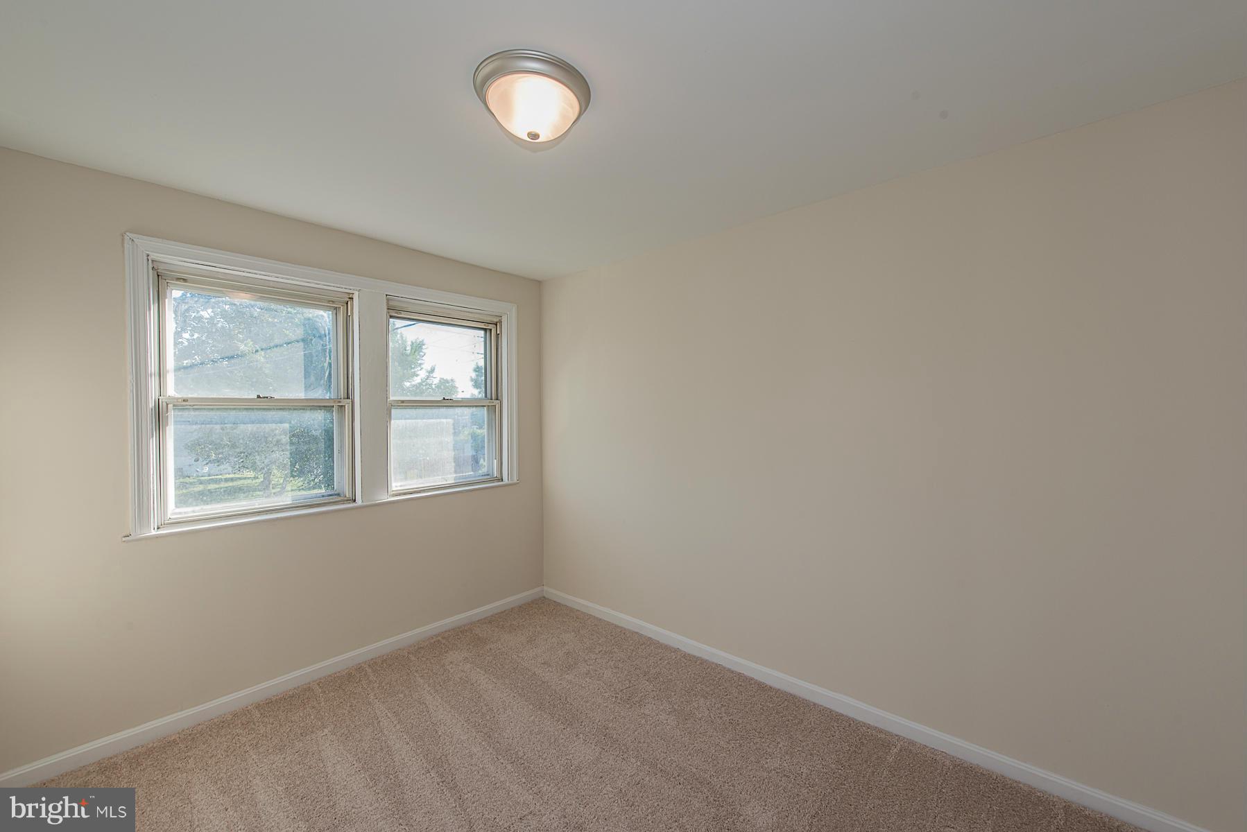 229 West Edgevale Road Baltimore, MD 21225 - Photo 3 of 13 an empty room with windows