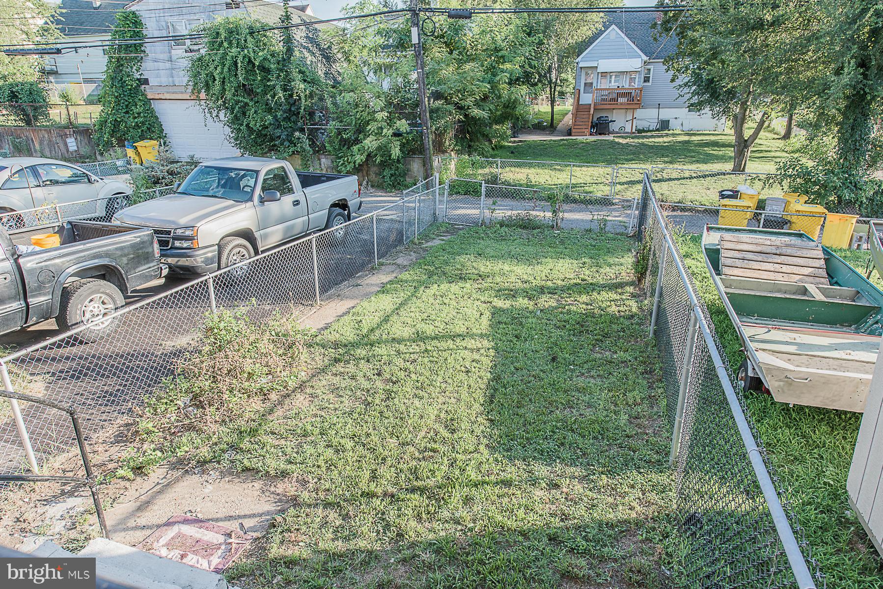 229 West Edgevale Road Baltimore, MD 21225 - Photo 4 of 13 a view of a house with a yard