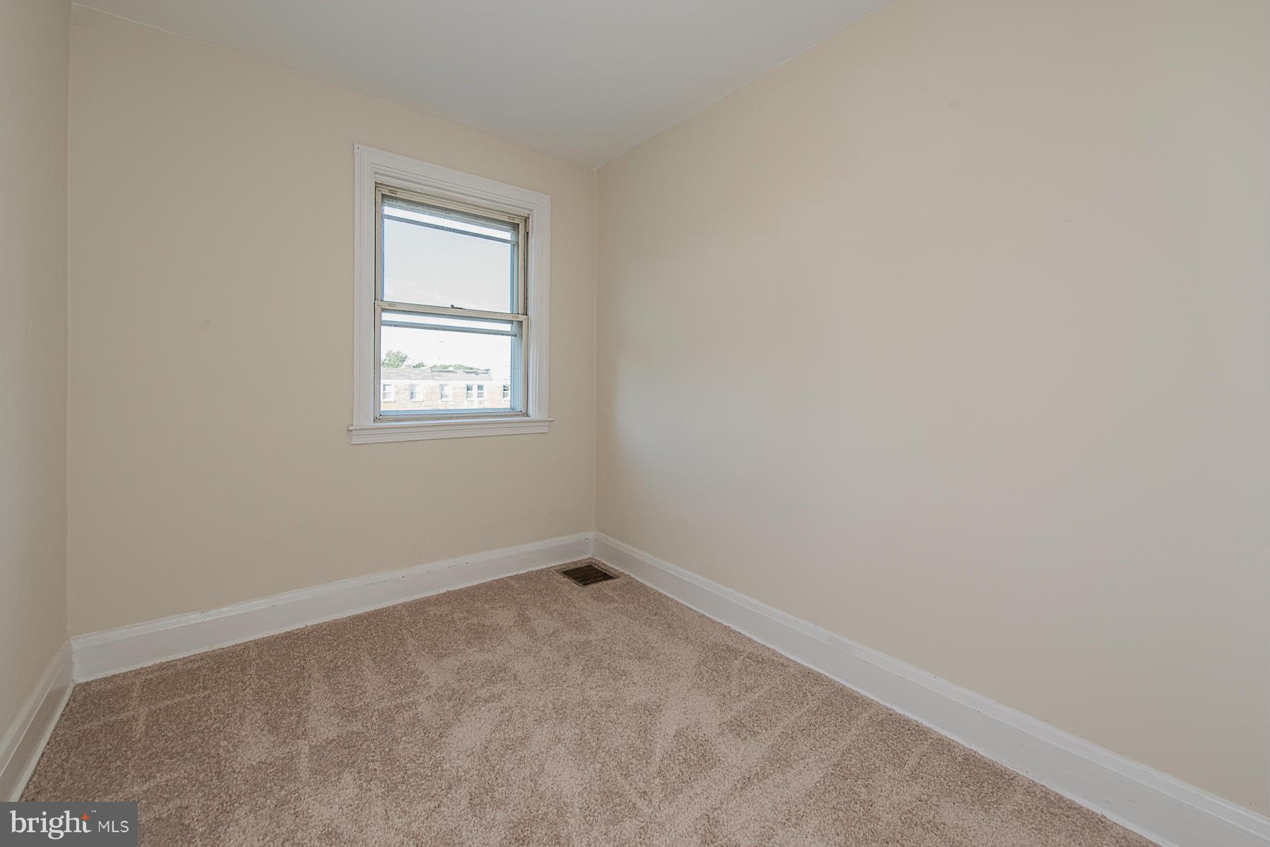 229 West Edgevale Road Baltimore, MD 21225 - Photo 8 of 13 an empty room with a window