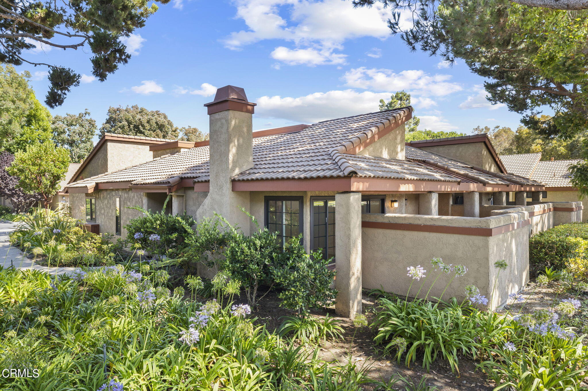 3764 Via Pacifica Walk Oxnard, CA 93035 - Photo 1 of 44 a front view of a house with a garden