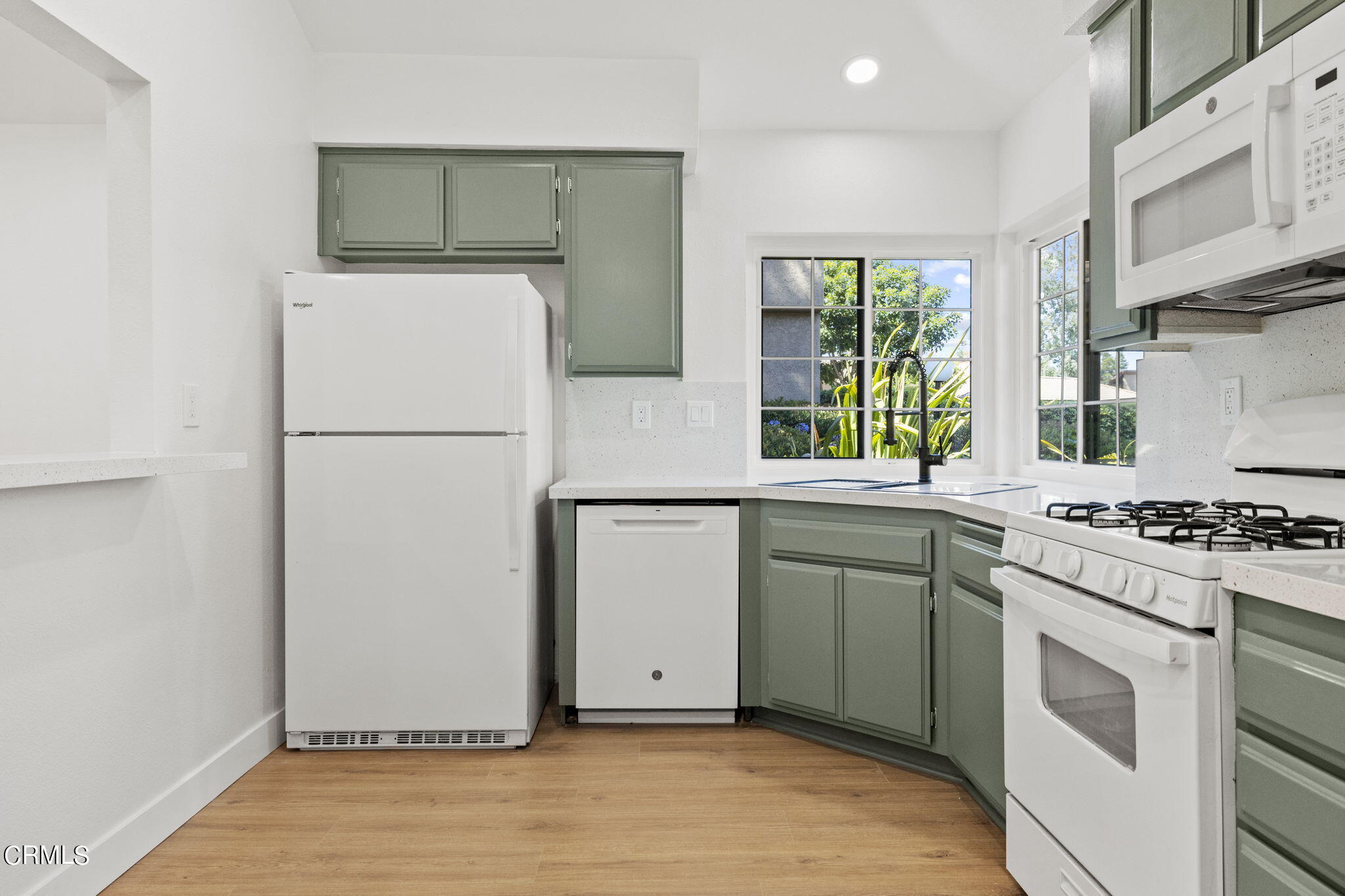 3764 Via Pacifica Walk Oxnard, CA 93035 - Photo 11 of 44 a kitchen with a refrigerator and a stove