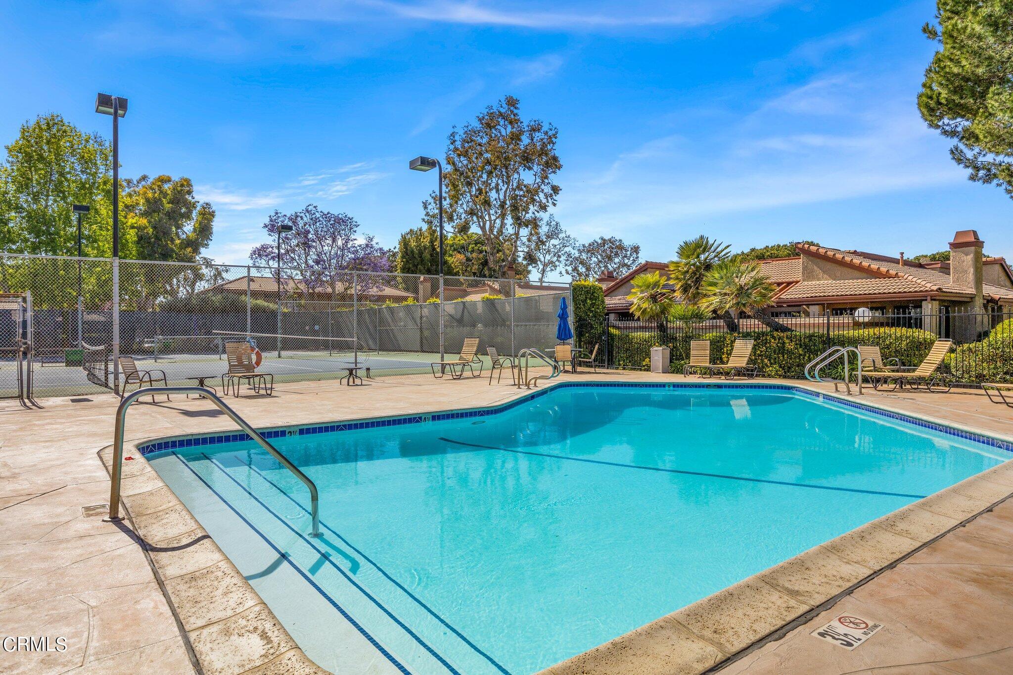 3764 Via Pacifica Walk Oxnard, CA 93035 - Photo 40 of 44 a view of a swimming pool with an ocean view
