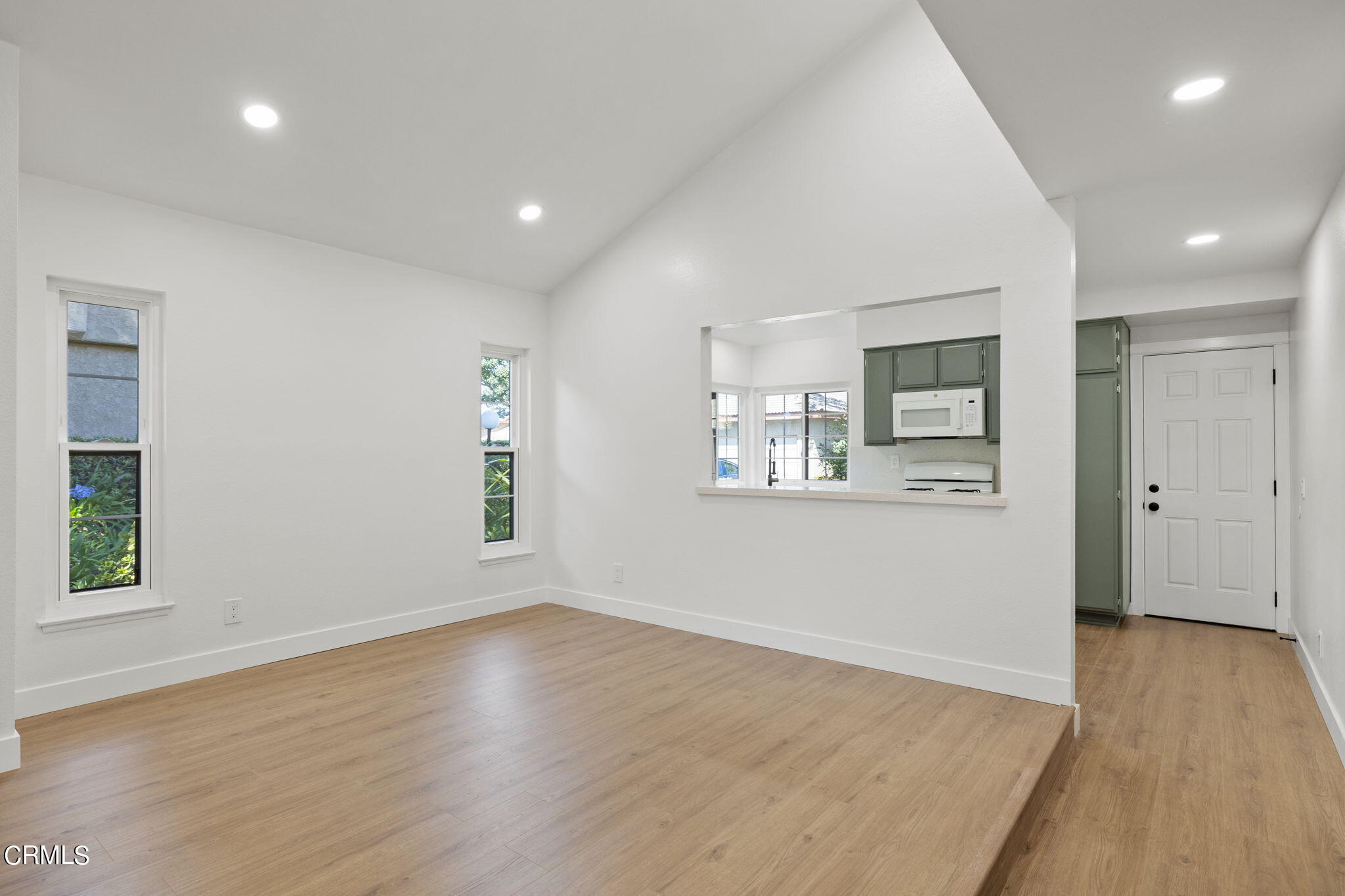 3764 Via Pacifica Walk Oxnard, CA 93035 - Photo 8 of 44 an empty room with wooden floor and windows