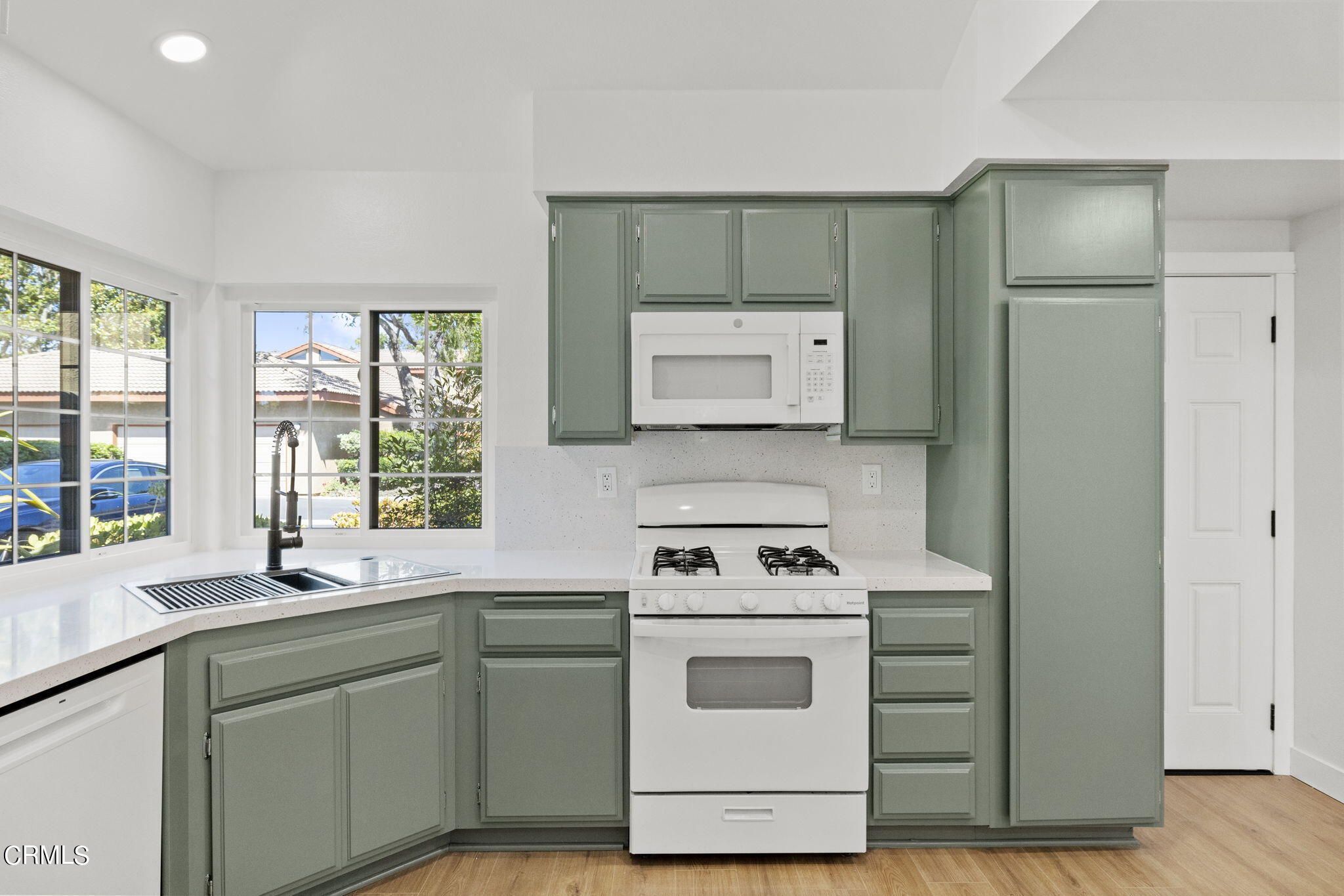 3764 Via Pacifica Walk Oxnard, CA 93035 - Photo 10 of 44 a kitchen with a stove oven and sink