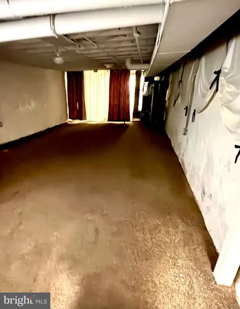 a view of a hallway with stairs