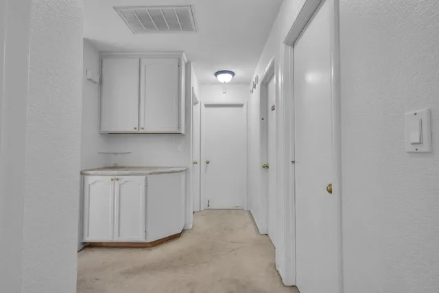 a view of cabinets and wooden cabinets