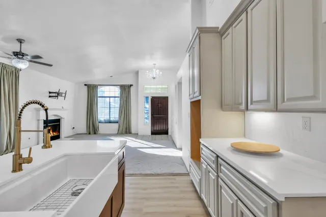 a bathroom with a tub sink and mirror