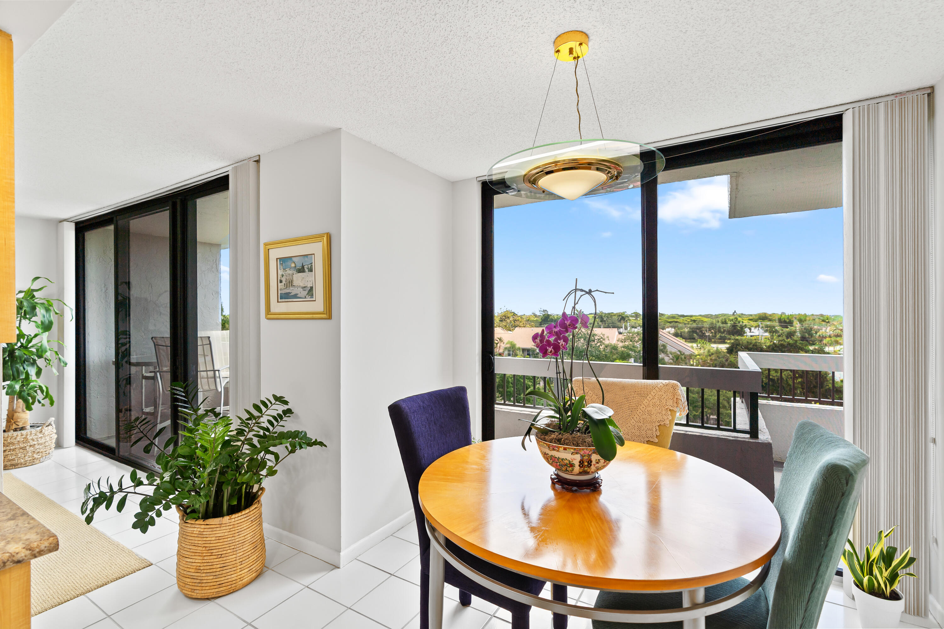23200 Camino Del Mar, Unit 603 Boca Raton, FL 33433 - Photo 15 of 43 a dining room with furniture and a potted plant