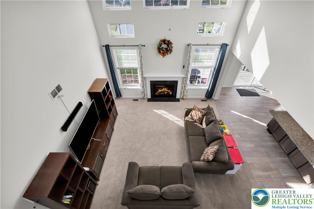4247 Beech Drive Nazareth, PA 18064 - Photo 15 of 42 a living room with furniture and a fireplace