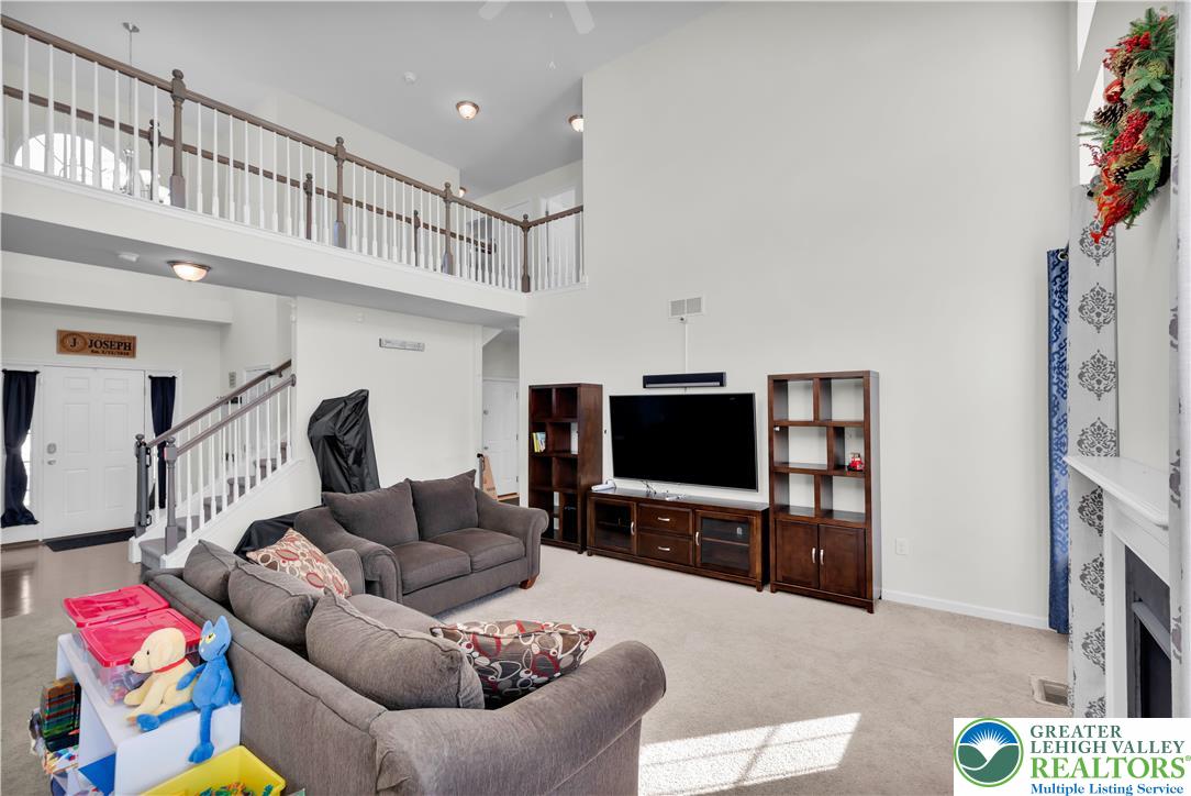 4247 Beech Drive Nazareth, PA 18064 - Photo 16 of 42 a living room with furniture and a flat screen tv