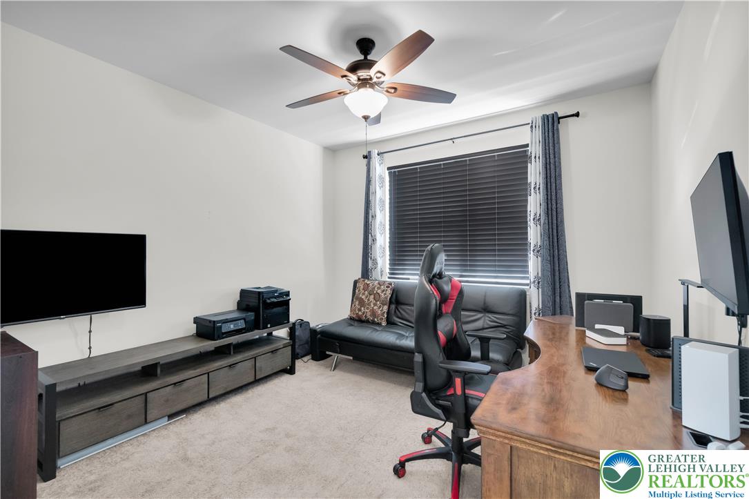 4247 Beech Drive Nazareth, PA 18064 - Photo 20 of 42 a work room with furniture and a flat screen tv