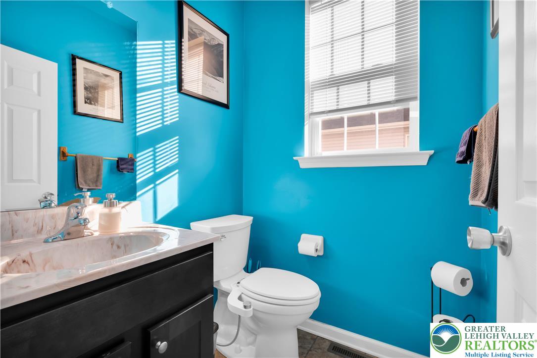 4247 Beech Drive Nazareth, PA 18064 - Photo 22 of 42 a bathroom with a toilet a sink and a mirror