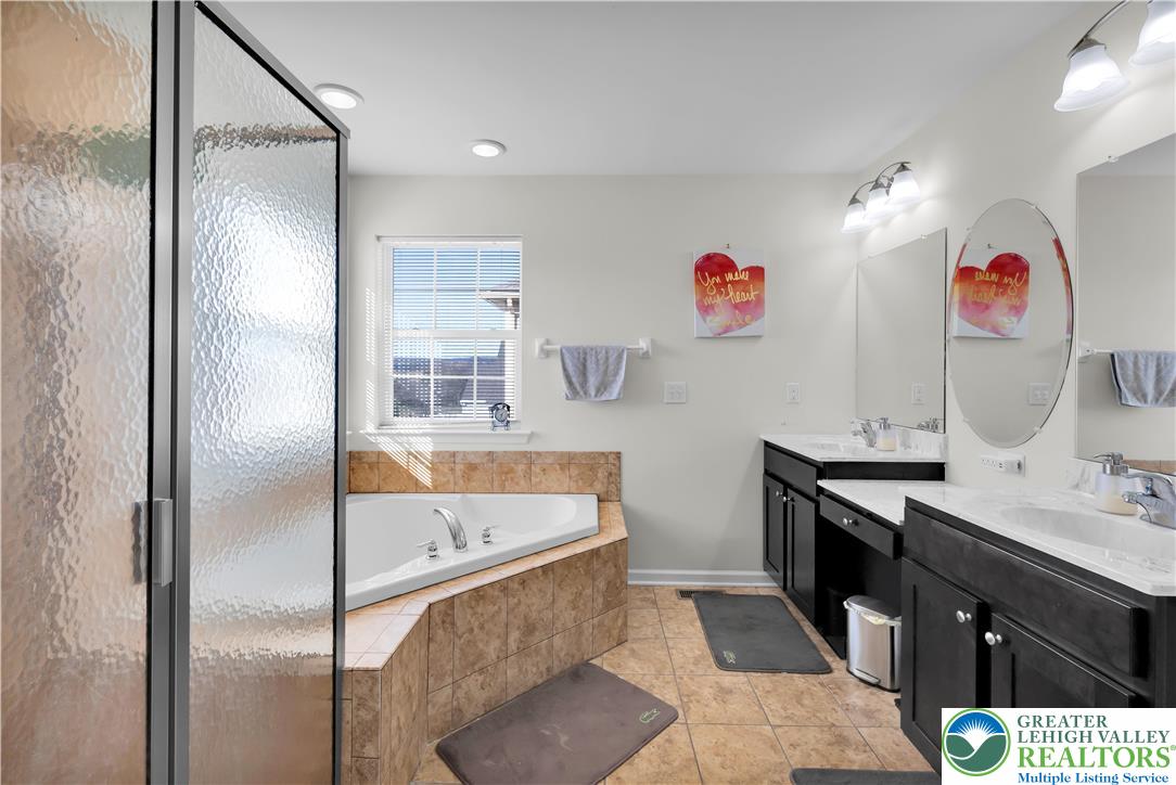 4247 Beech Drive Nazareth, PA 18064 - Photo 28 of 42 a hallway with a sink and a mirror