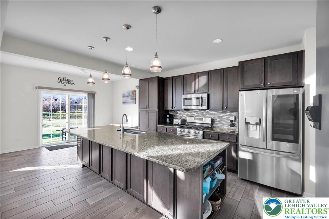 4247 Beech Drive Nazareth, PA 18064 - Photo 8 of 42 a kitchen with stainless steel appliances granite countertop a sink stove and refrigerator