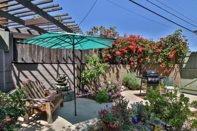 a view of a porch with furniture and a yard