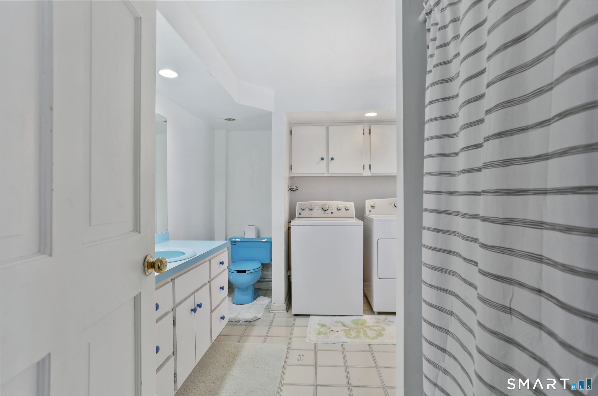 40 Rose Terrace Trumbull, CT 06611 - Photo 17 of 24 a utility room with cabinets washer and dryer