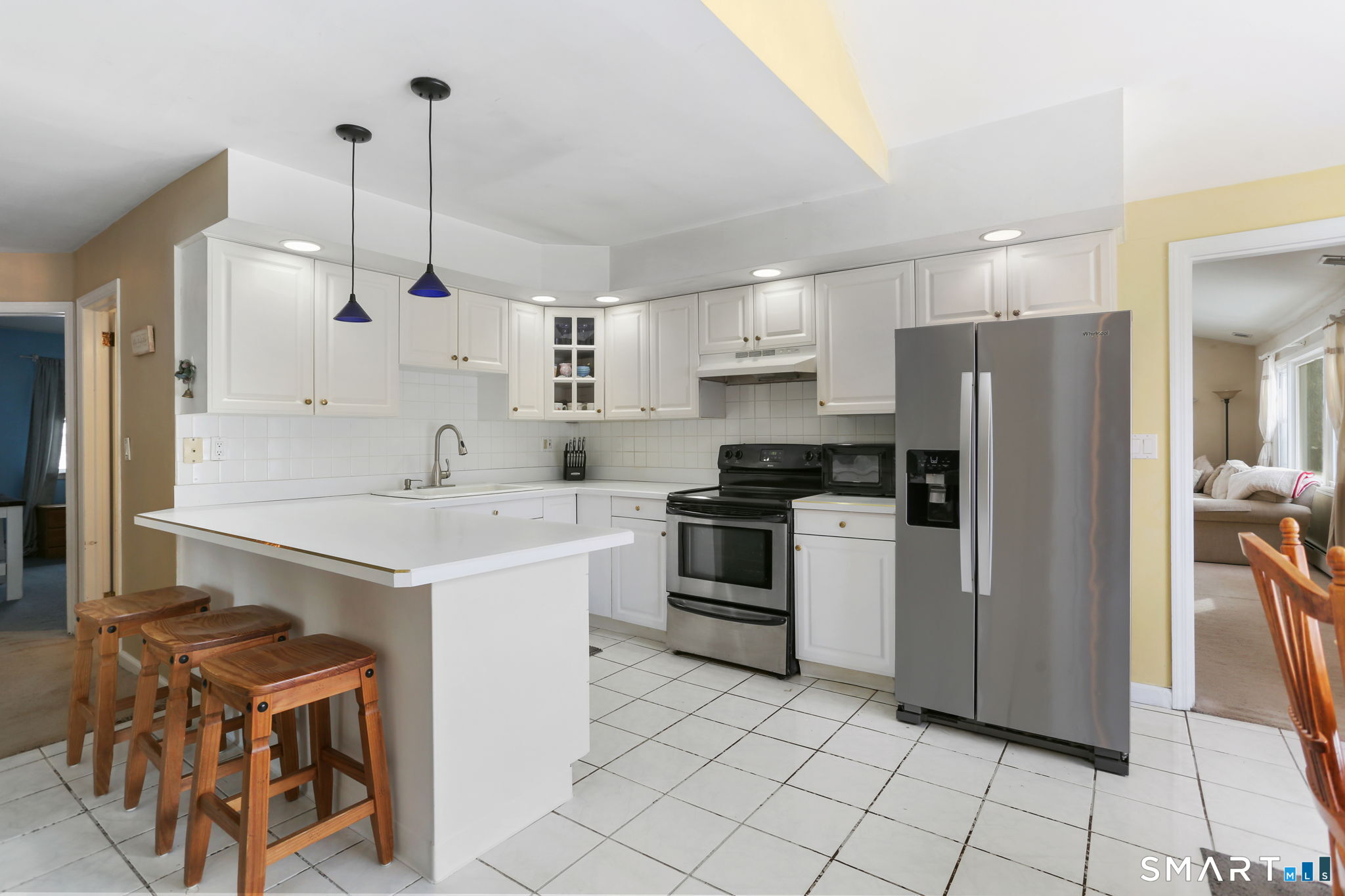 40 Rose Terrace Trumbull, CT 06611 - Photo 2 of 24 a kitchen with stainless steel appliances a stove a sink and a refrigerator