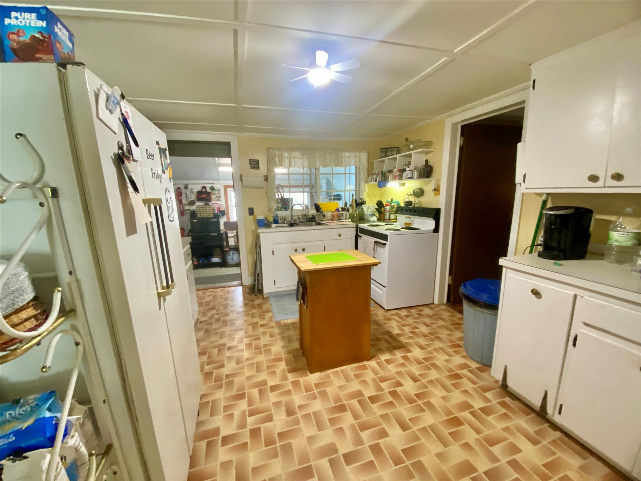 1135 Beaver Dam Road Washington, GA 30673 - Photo 12 of 42 a kitchen with a sink appliances and cabinets