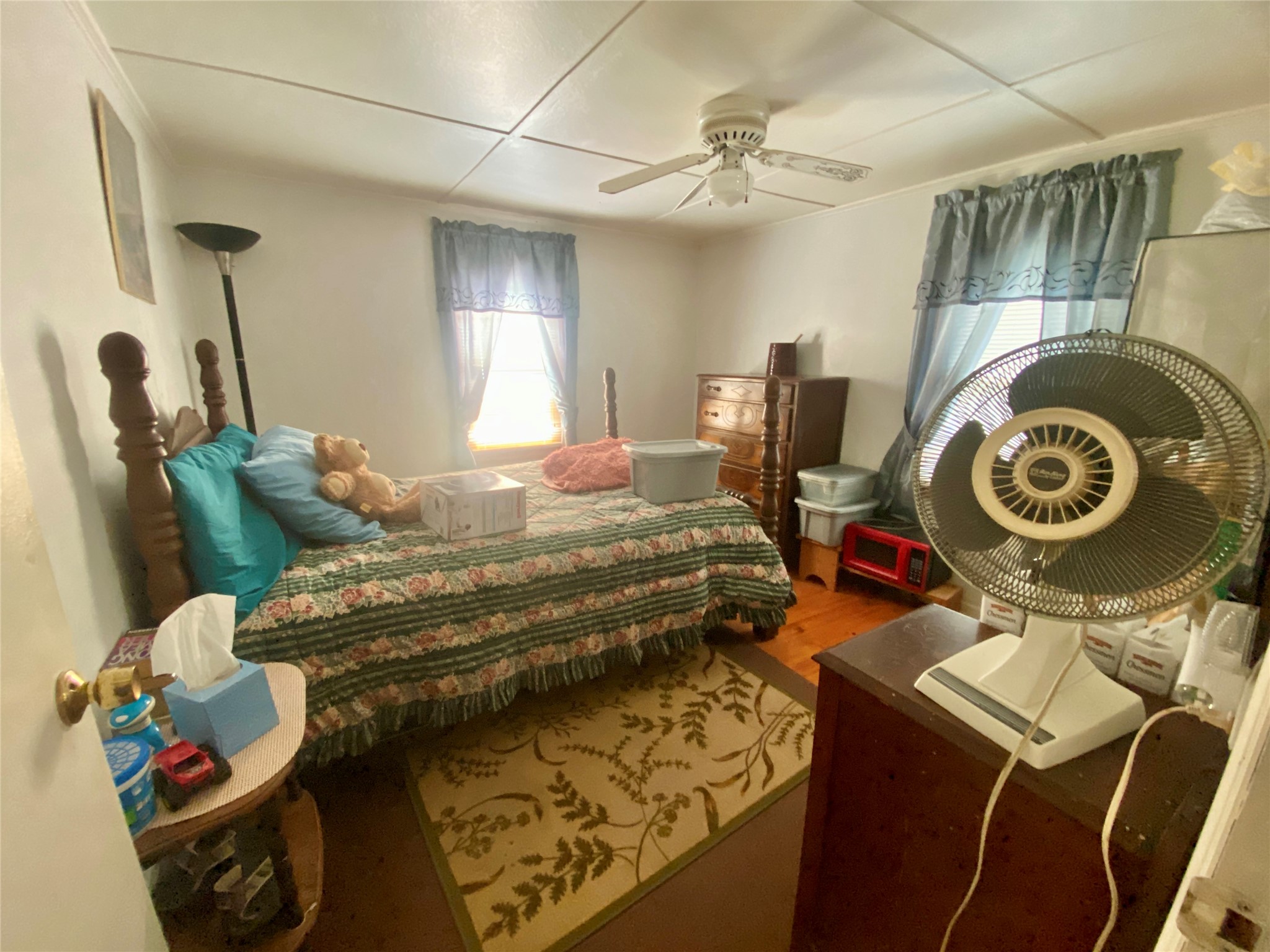 1135 Beaver Dam Road Washington, GA 30673 - Photo 18 of 42 a bedroom with a bed and a chandelier