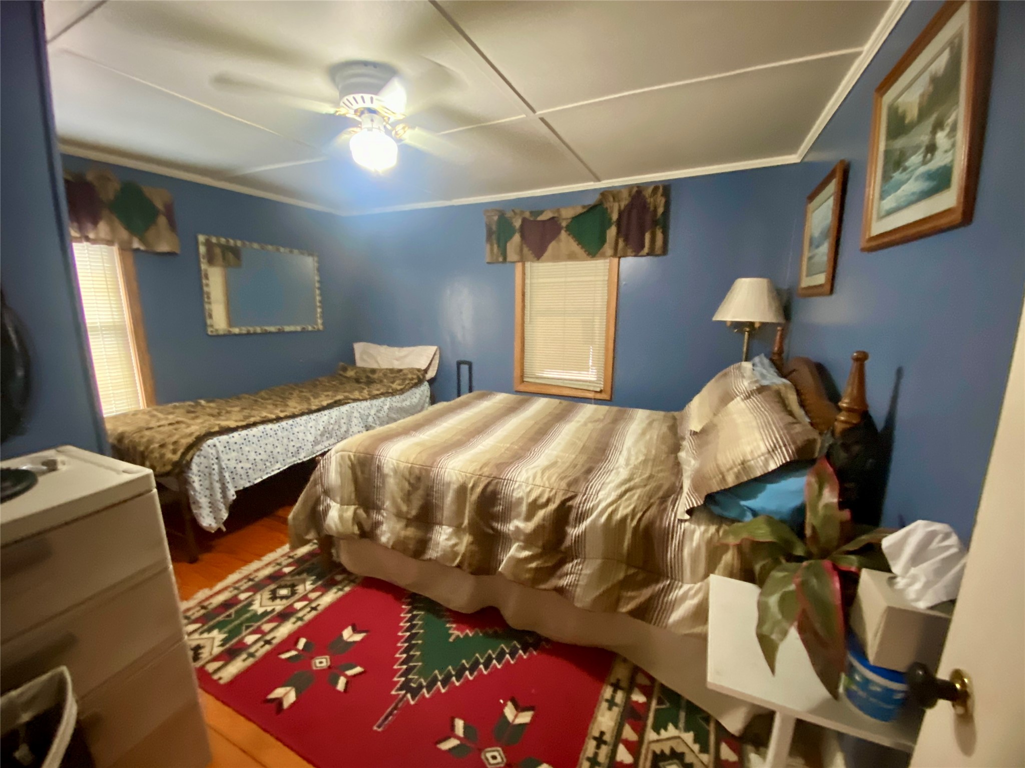 1135 Beaver Dam Road Washington, GA 30673 - Photo 20 of 42 a bedroom with a bed and a chandelier