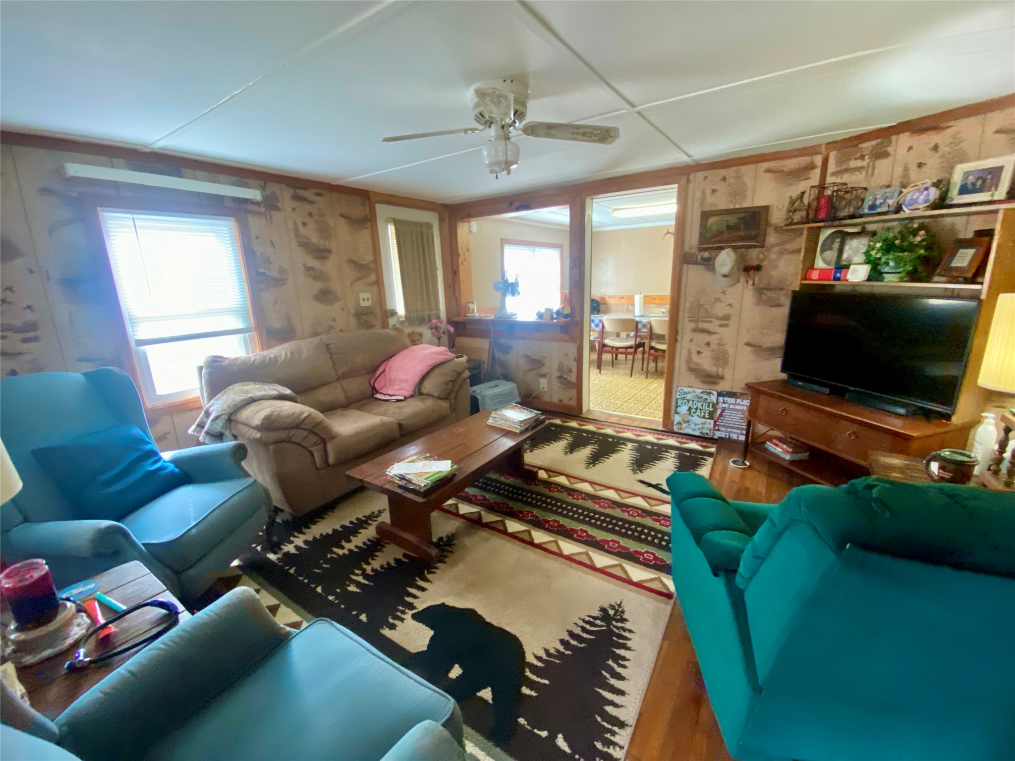 1135 Beaver Dam Road Washington, GA 30673 - Photo 8 of 42 a living room with furniture and a flat screen tv