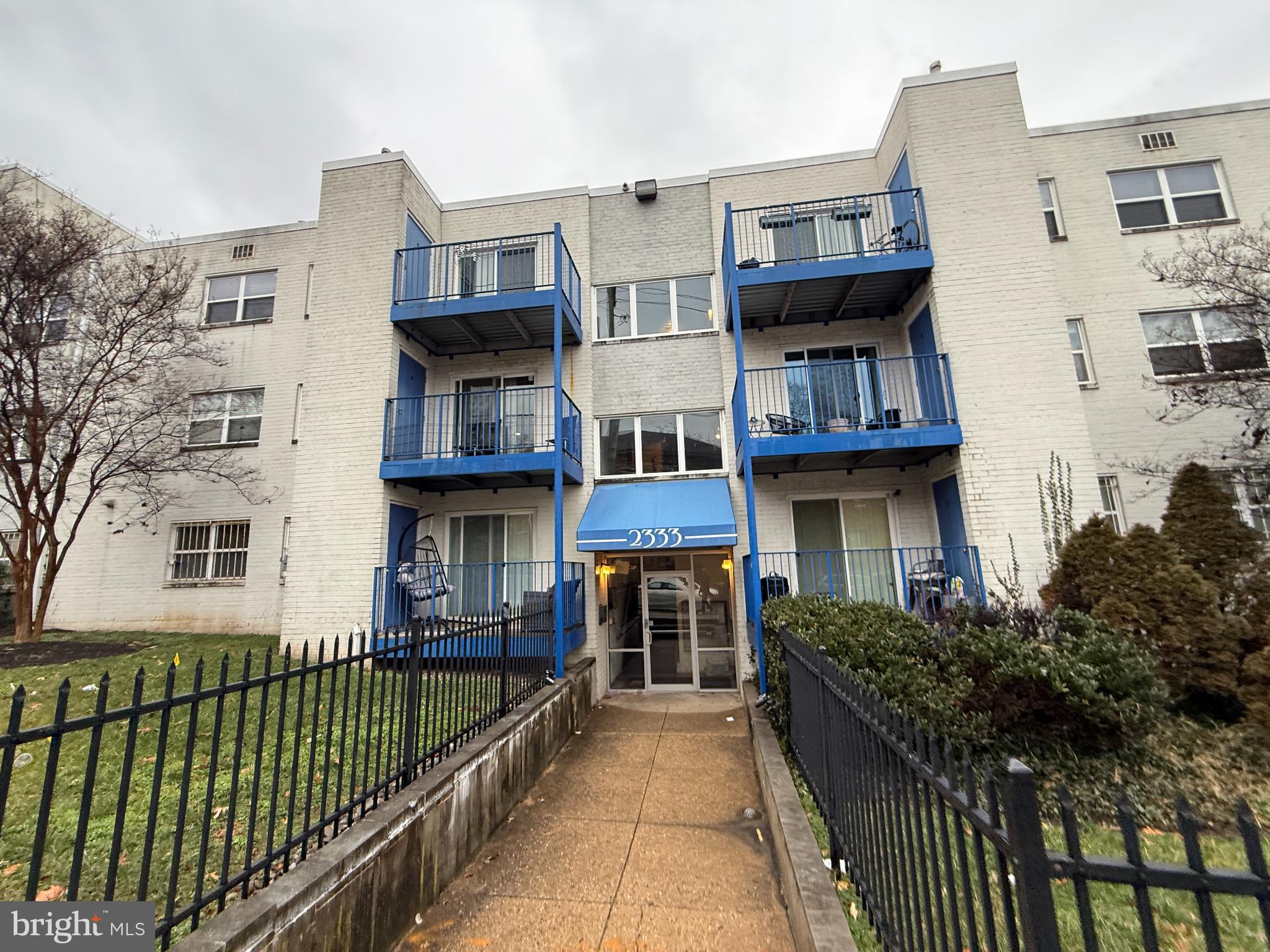 Charming apartment building with blue accents.