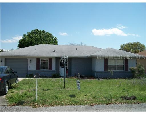 246 Westridge Road Davenport, FL 33837 - Photo 1 of 1 a view of a house with a garden