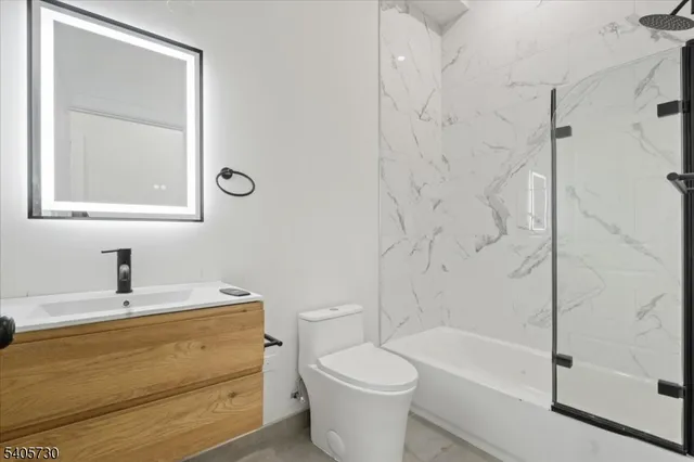 a bathroom with a sink a toilet and a bathtub