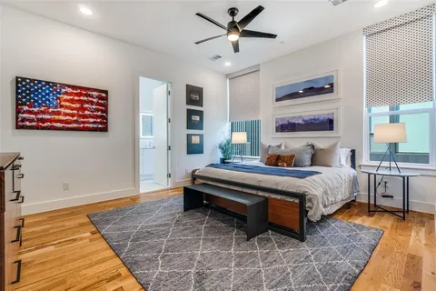 a bedroom with a bed and dresser