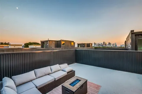 a view of roof deck with couches
