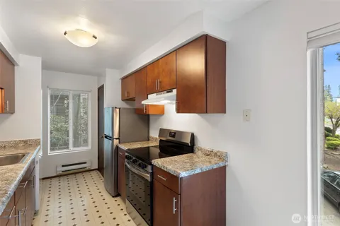a kitchen with a stove and a sink