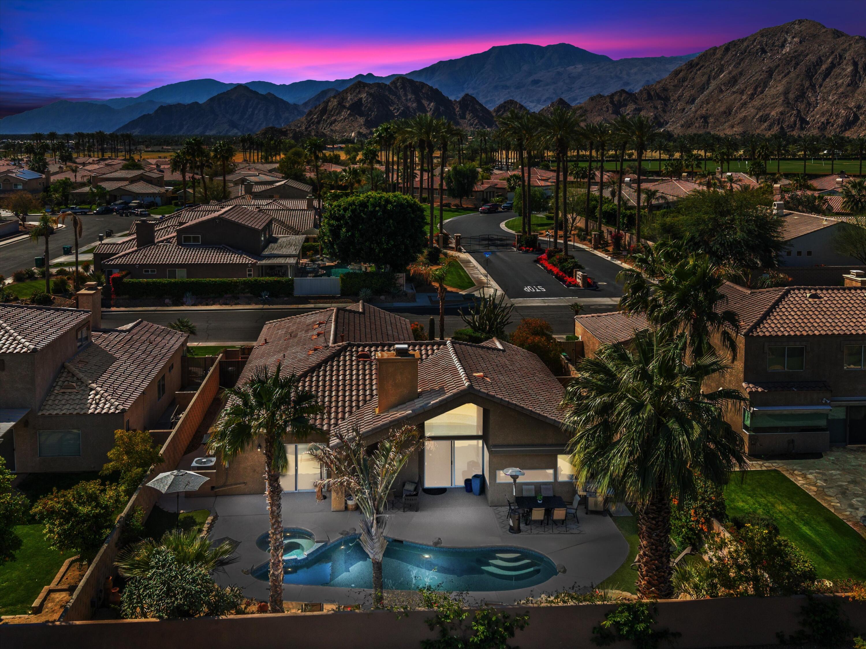 a view of a town with mountains in the background