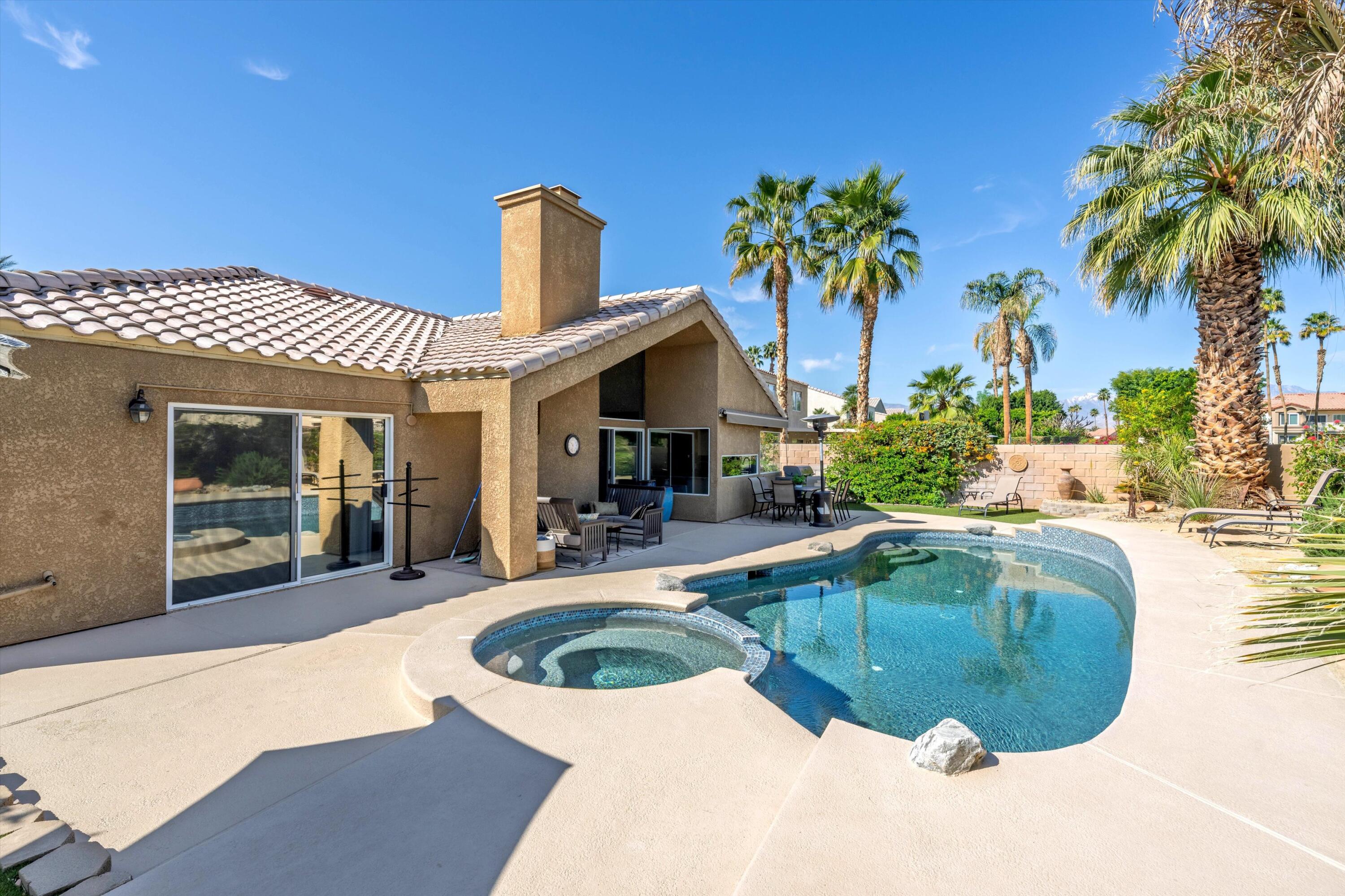 78330 Vía Sevilla La Quinta, CA 92253 - Photo 21 of 49 a view of a house with swimming pool and sitting area
