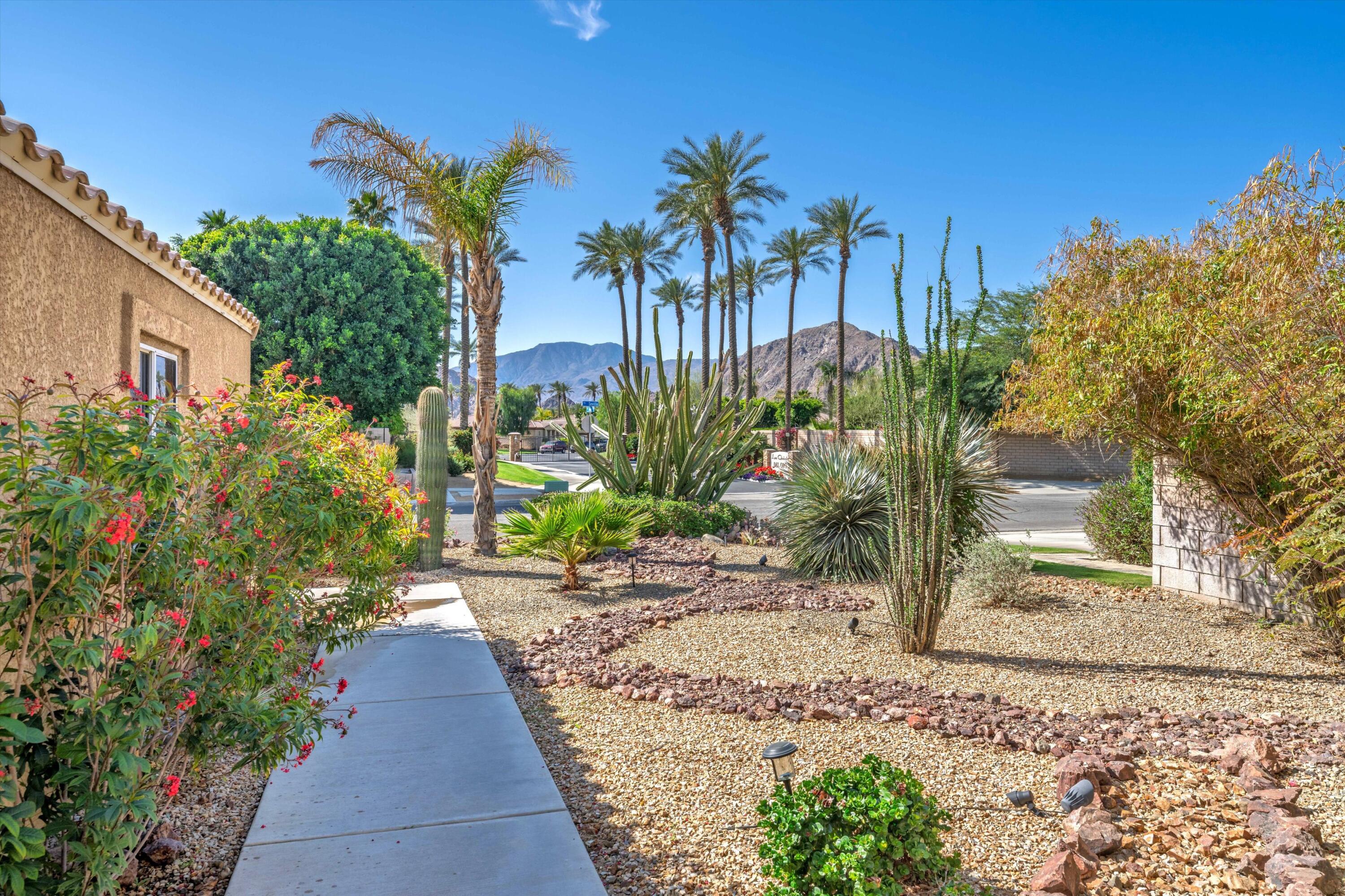 78330 Vía Sevilla La Quinta, CA 92253 - Photo 24 of 49 a view of a backyard with potted plants