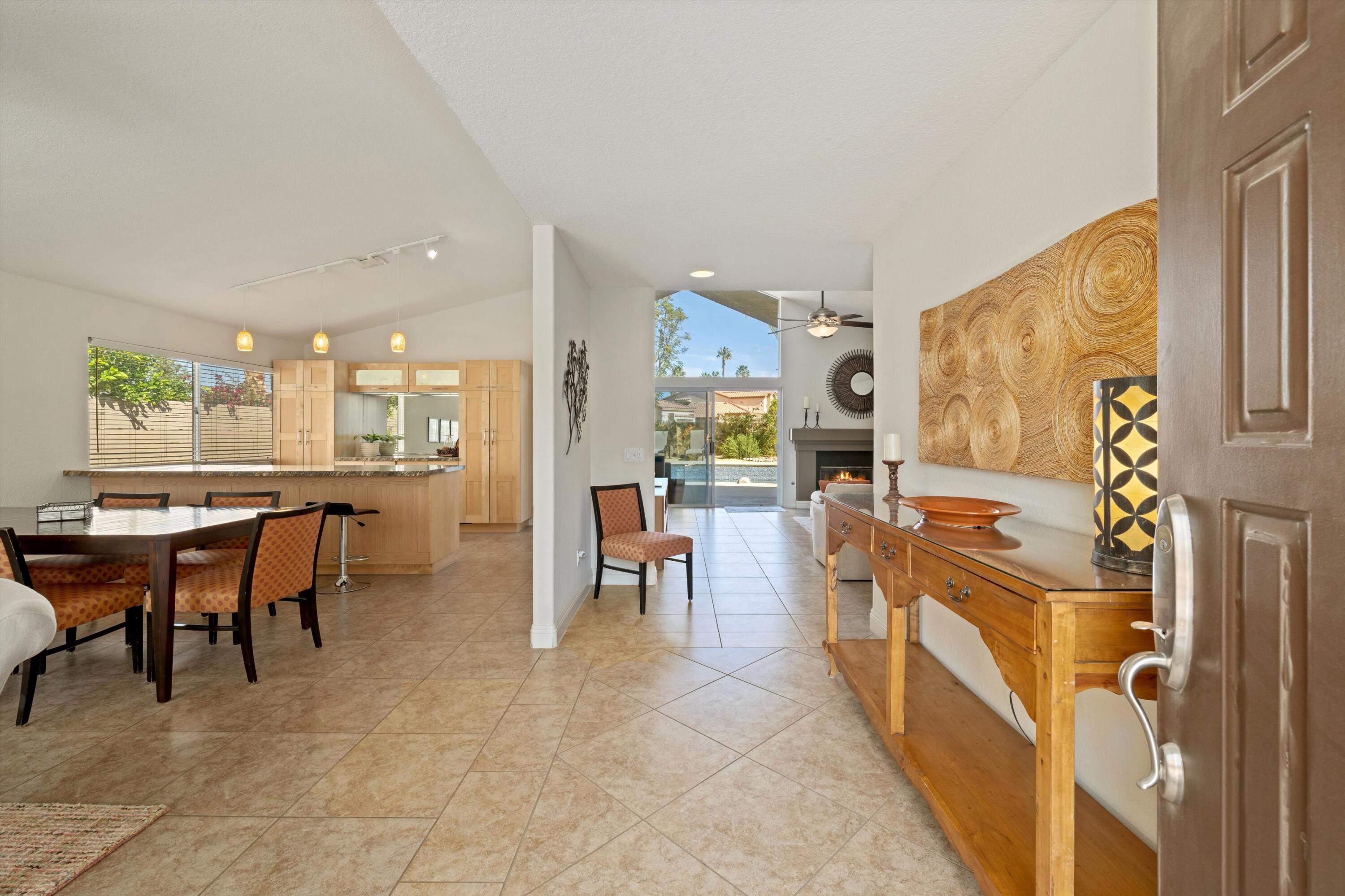 78330 Vía Sevilla La Quinta, CA 92253 - Photo 26 of 49 a room with stainless steel appliances lots of wooden furniture
