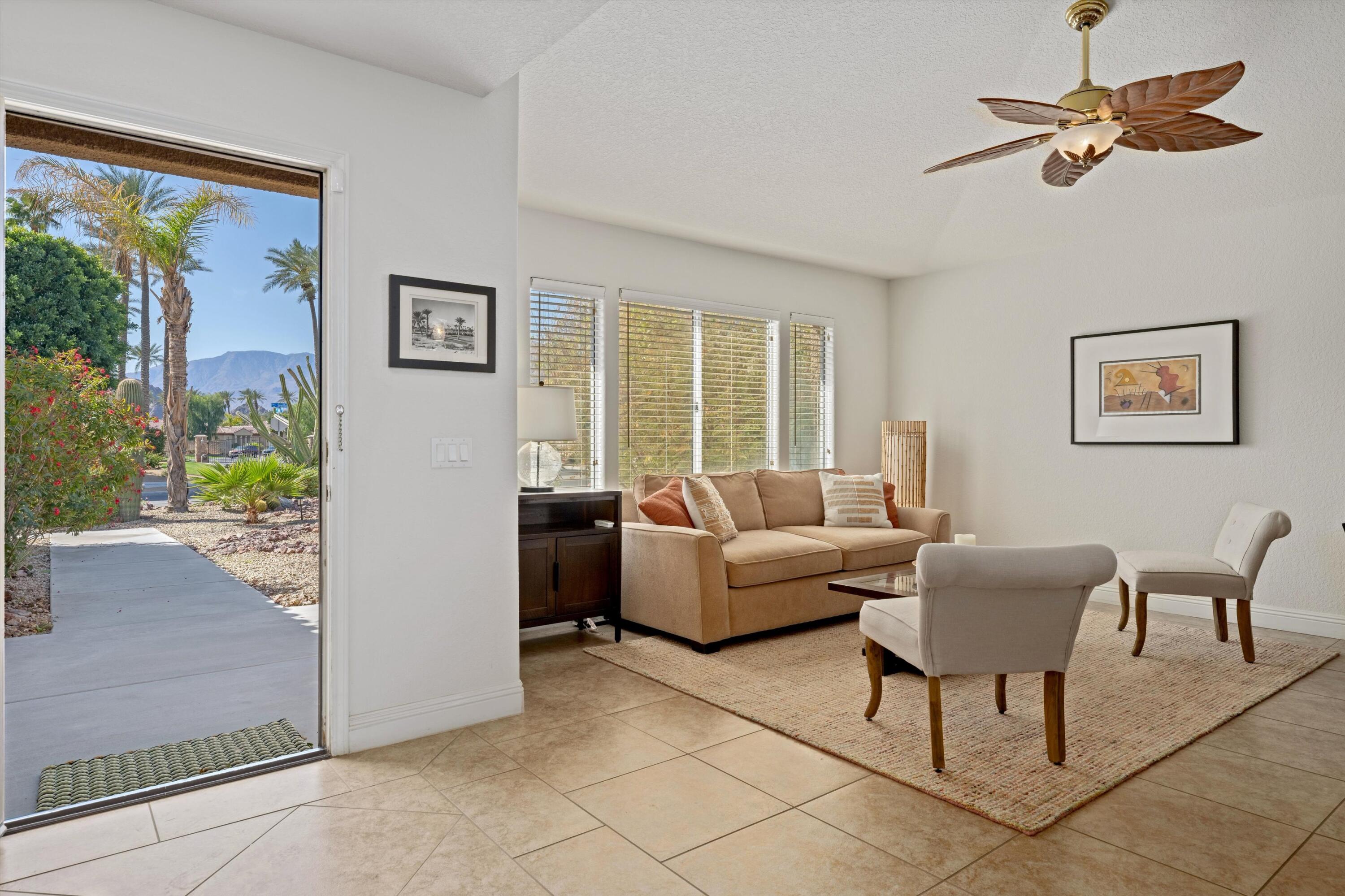 78330 Vía Sevilla La Quinta, CA 92253 - Photo 28 of 49 a living room with furniture and a window