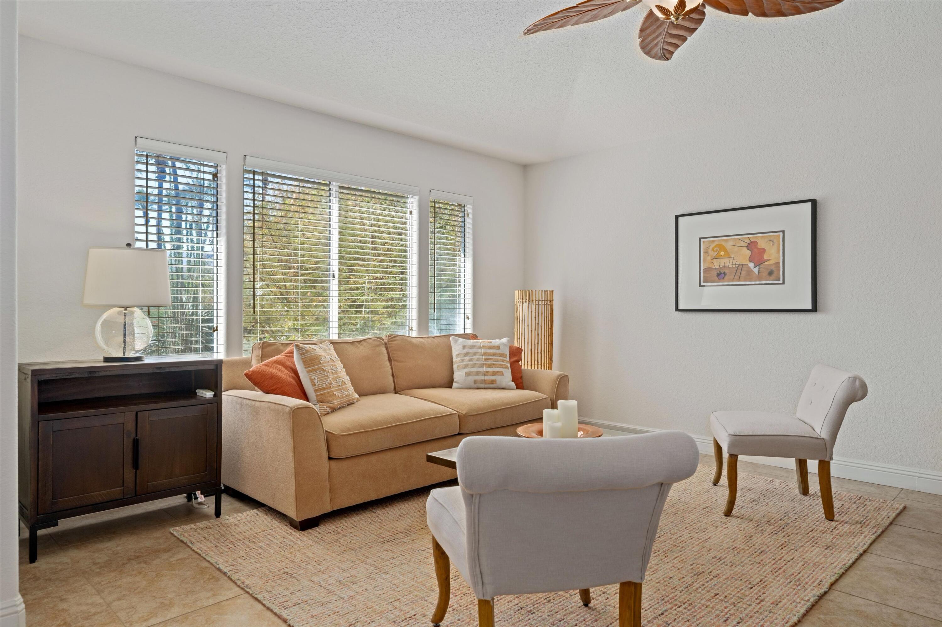 78330 Vía Sevilla La Quinta, CA 92253 - Photo 29 of 49 a living room with furniture and a large window