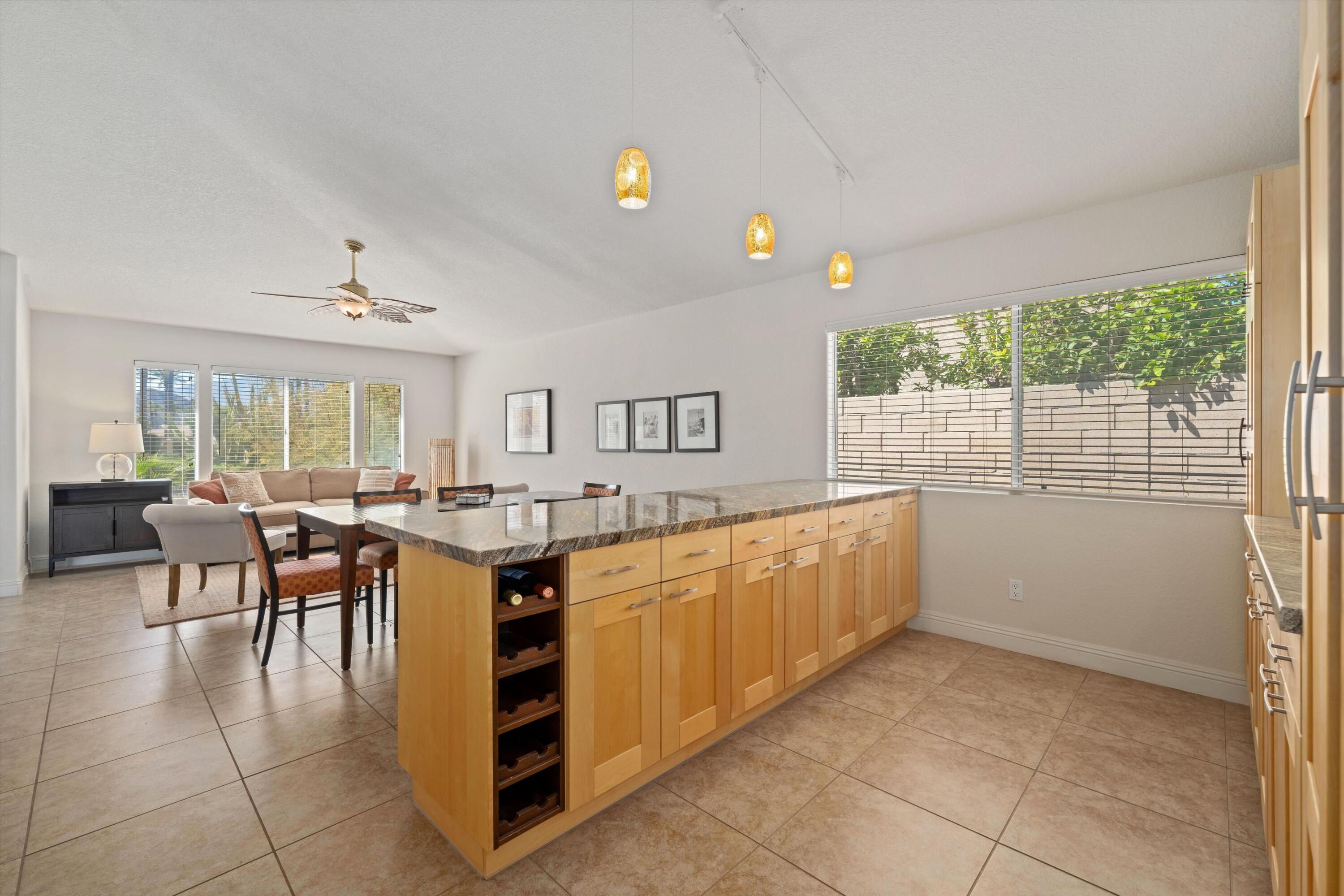78330 Vía Sevilla La Quinta, CA 92253 - Photo 33 of 49 a kitchen with stainless steel appliances granite countertop a refrigerator and a sink