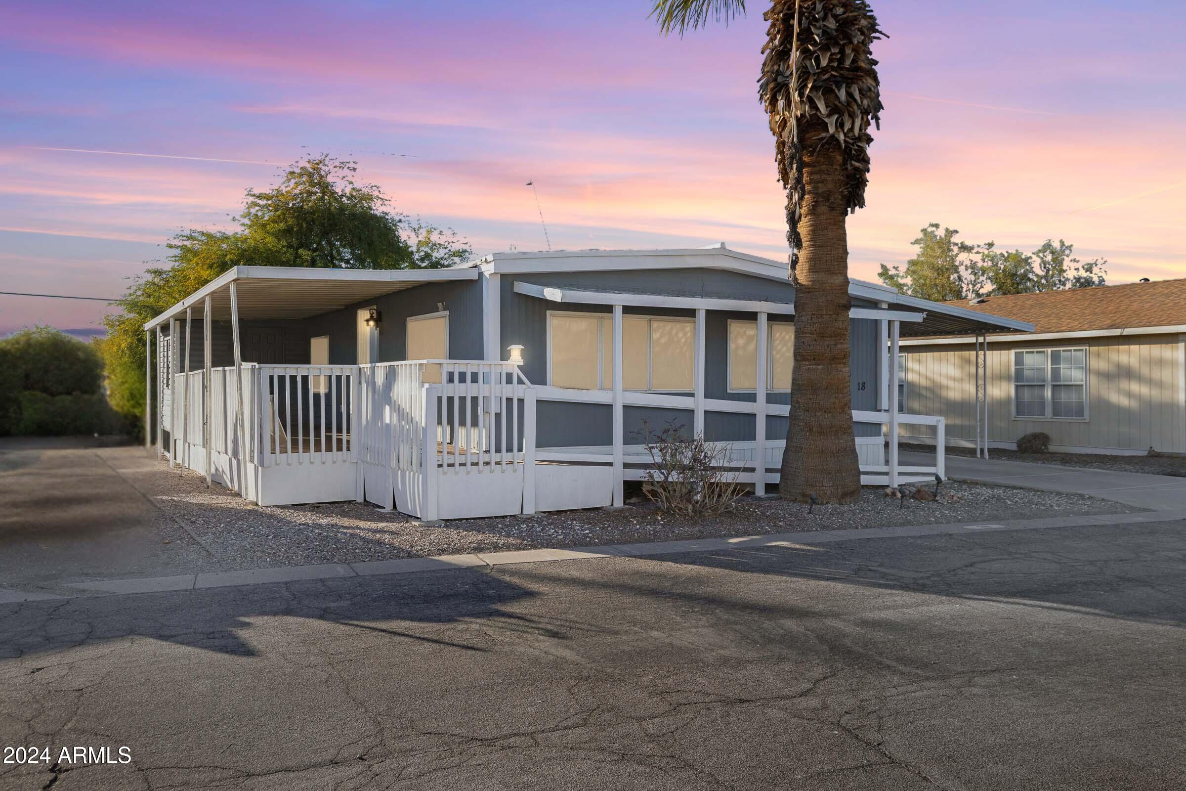 201 South Greenfield Road, Unit 18 Mesa, AZ 85206 - Photo 1 of 17 a front view of a house with a porch