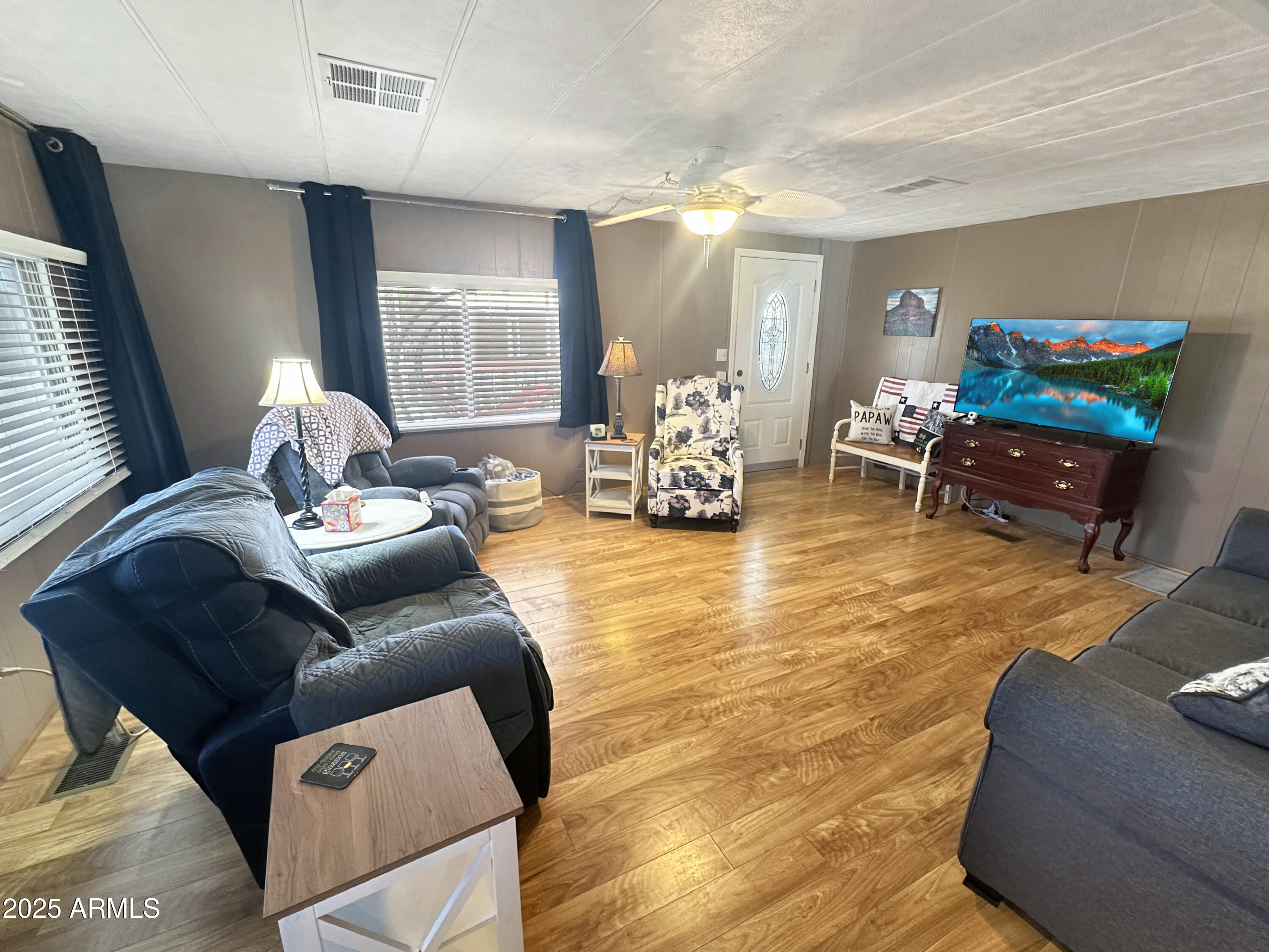 201 South Greenfield Road, Unit 18 Mesa, AZ 85206 - Photo 11 of 17 a living room with furniture and a flat screen tv