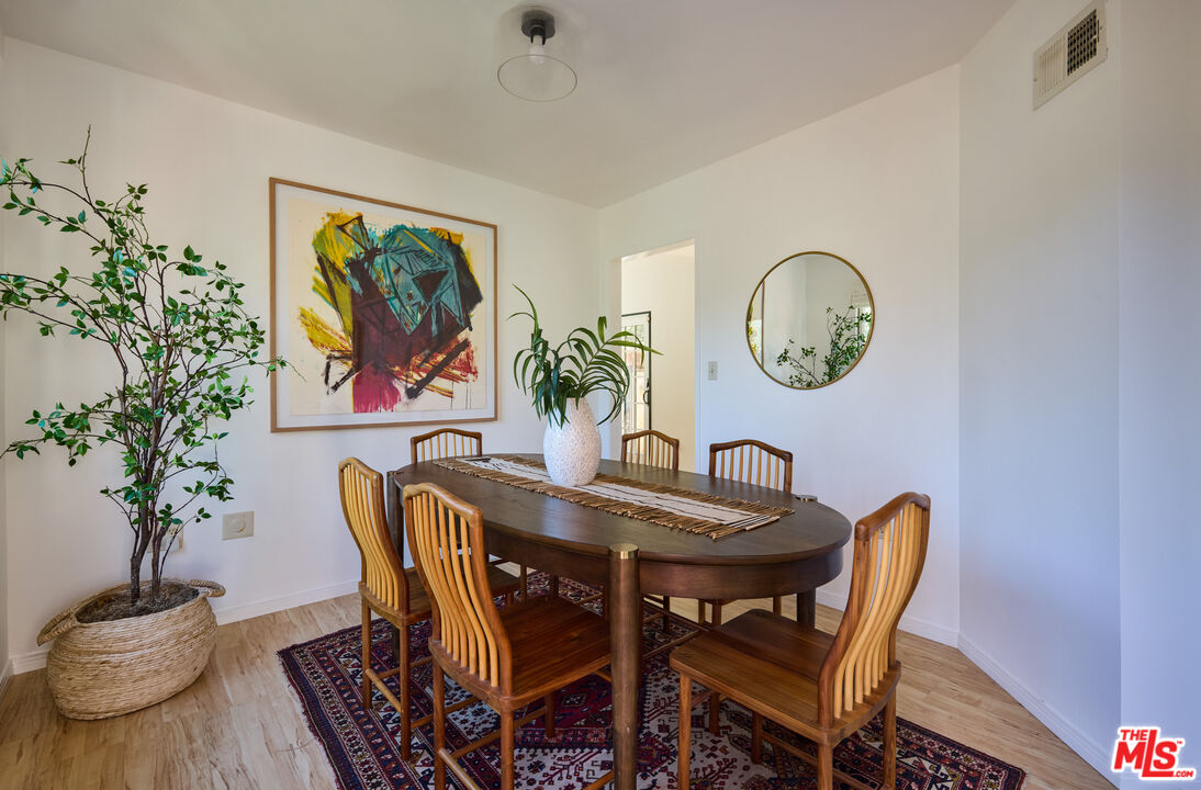 6948 St Estaban Street Tujunga, CA 91042 - Photo 13 of 26 a dining room with furniture and wooden floor