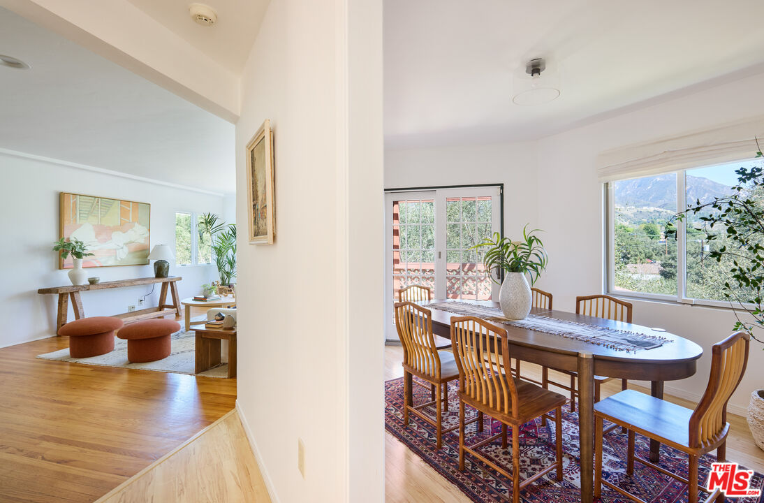 6948 St Estaban Street Tujunga, CA 91042 - Photo 15 of 26 a view of a dining room with furniture and wooden floor