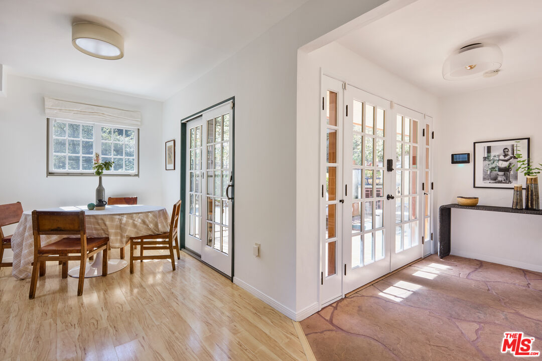 6948 St Estaban Street Tujunga, CA 91042 - Photo 16 of 26 a view of a dining room with furniture and wooden floor