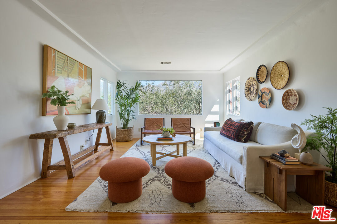 6948 St Estaban Street Tujunga, CA 91042 - Photo 17 of 26 a living room with furniture and a large window