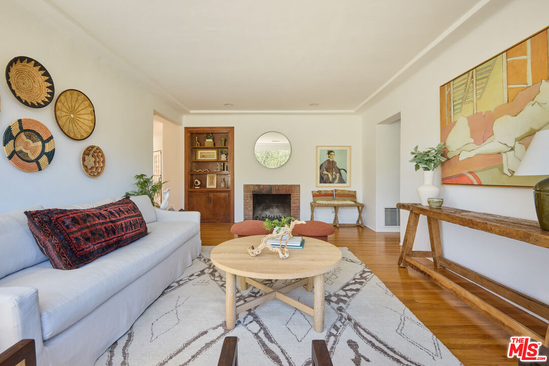 6948 St Estaban Street Tujunga, CA 91042 - Photo 19 of 26 a living room with furniture and wooden floor