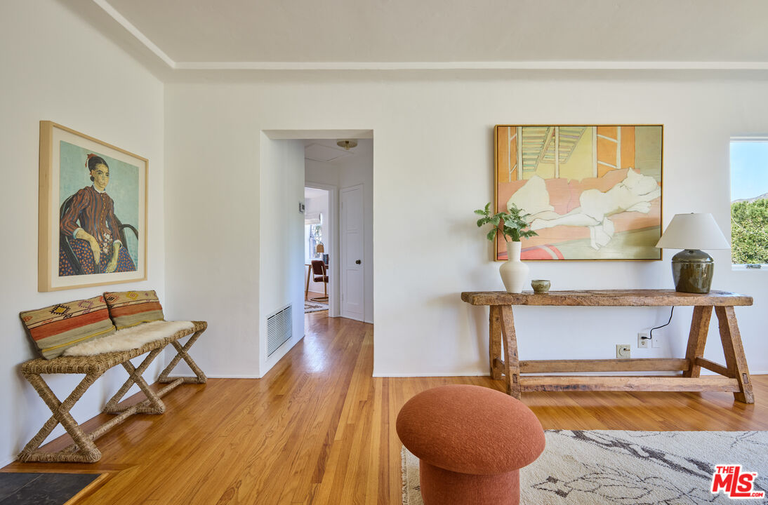 6948 St Estaban Street Tujunga, CA 91042 - Photo 20 of 26 a living room with furniture and a large window